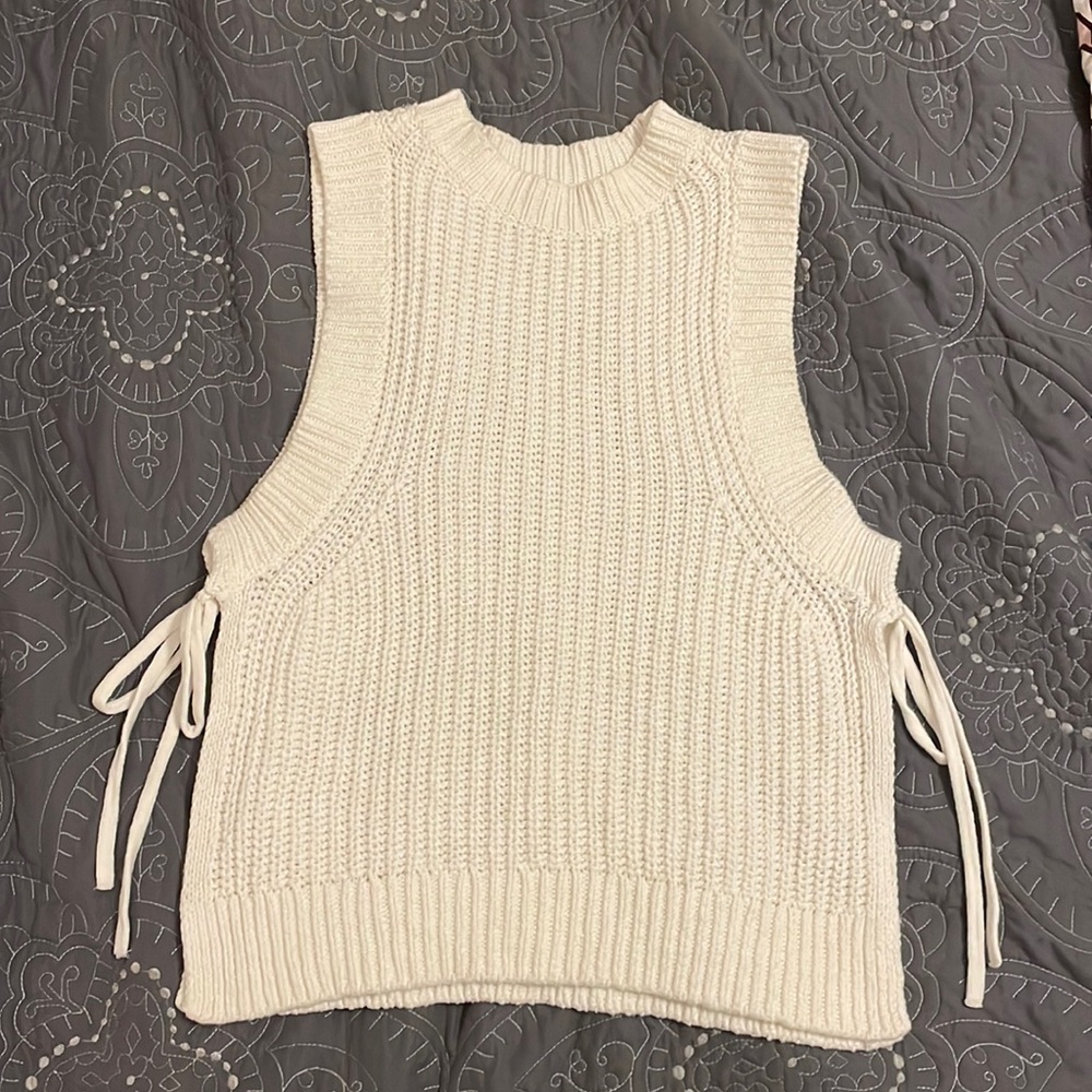 White sweater top with open sides